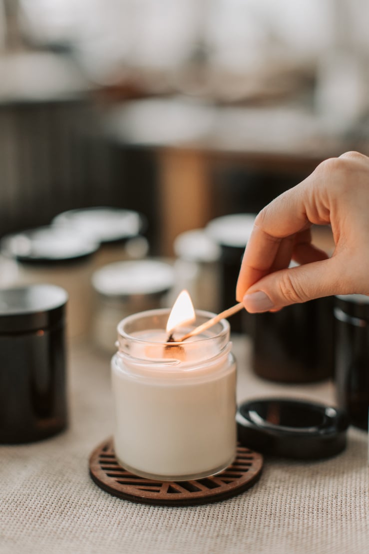 Person Lighting The Candle